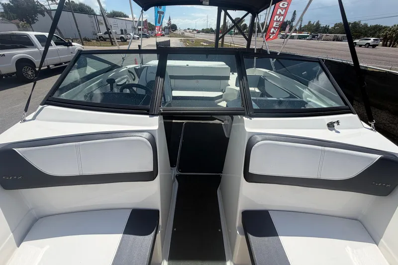 Slide: The Image of 2015 Sea Ray 19 SPX boat interior with seating and windshield view. - 38
