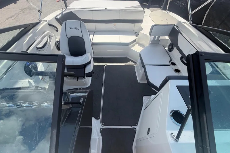 Slide: The Image of Interior view of a 2015 Sea Ray 19 SPX boat, featuring seating and steering area. - 39