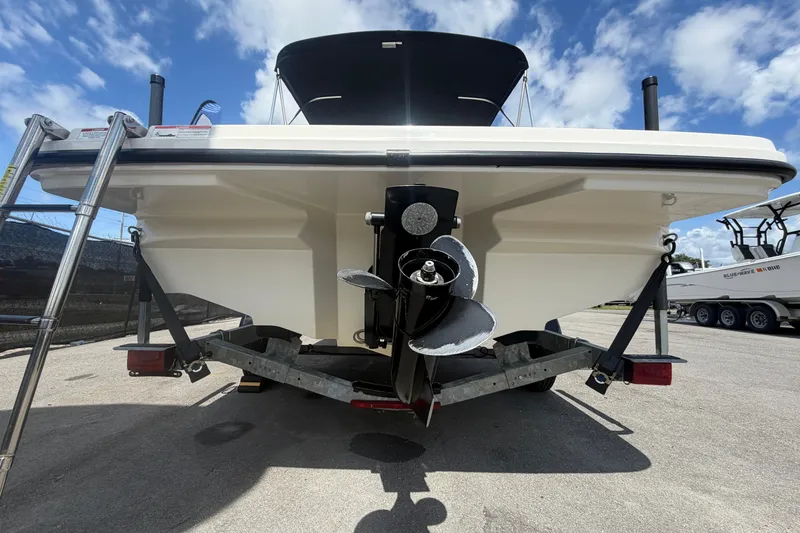Slide: The Image of Rear view of a 2015 Sea Ray 19 SPX boat on a trailer. - 4