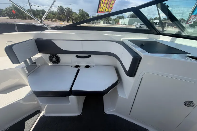 Slide: The Image of Interior seating of 2015 Sea Ray 19 SPX boat, featuring sleek design and cup holders. - 41