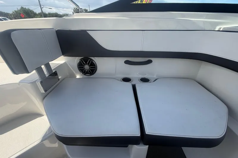 Slide: The Image of 2015 Sea Ray 19 SPX boat interior seating with cup holders and speaker. - 42