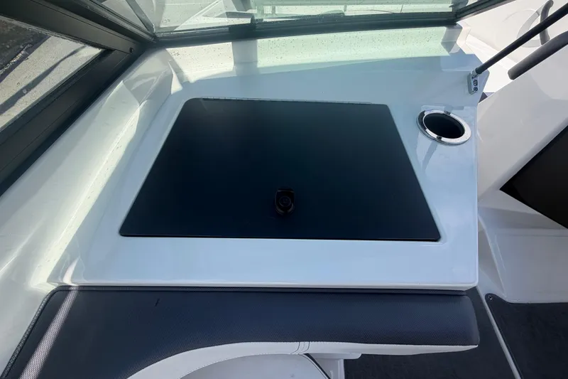 Slide: The Image of Interior view of a 2015 Sea Ray 19 SPX boat dashboard with cup holder. - 43