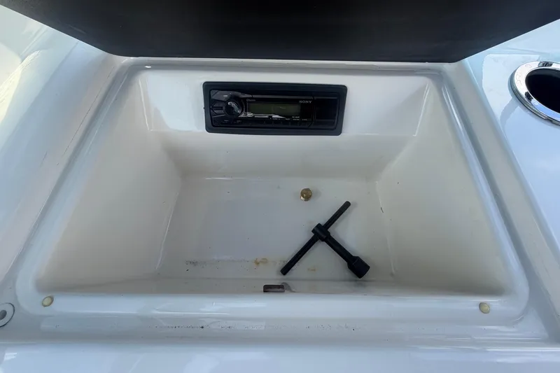 Slide: The Image of Interior of a 2015 Sea Ray 19 SPX boat with storage compartment. - 44