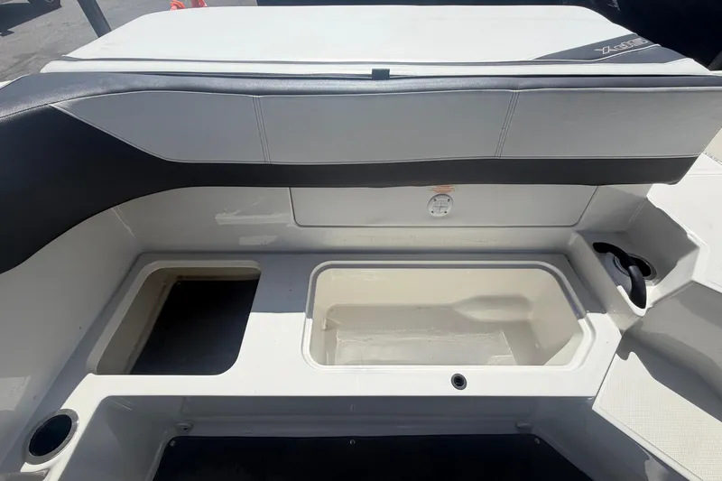 Slide: The Image of Interior of a 2015 Sea Ray 19 SPX boat, seating area and storage. - 47