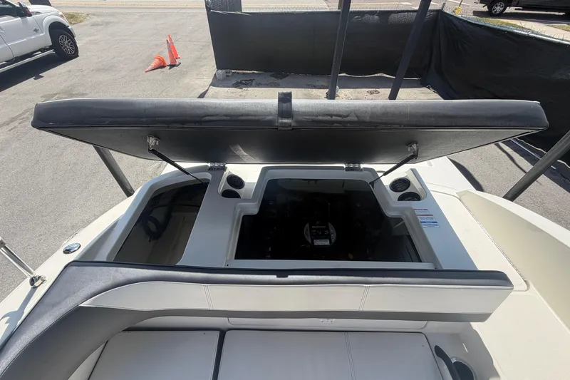 Slide: The Image of Open engine compartment of a 2015 Sea Ray 19 SPX boat, showcasing interior details. - 49