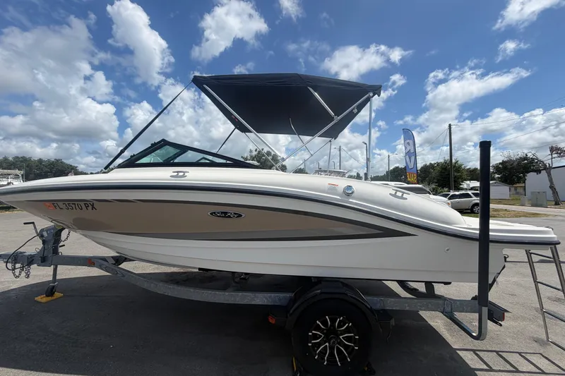 Slide: The Image of 2015 Sea Ray 19 SPX boat on trailer under blue sky with clouds. - 7