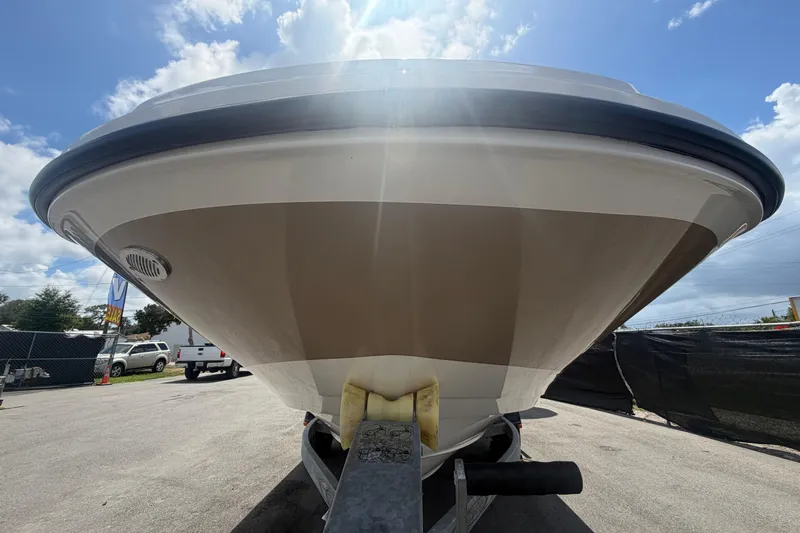 Slide: The Image of Front view of a 2015 Sea Ray 19 SPX boat on a trailer under a sunny sky. - 9