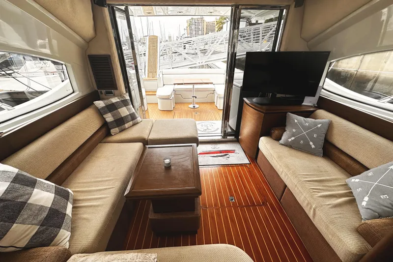 Slide: The Image of Luxurious interior of a 2007 Azimut 43S yacht with cozy seating and modern decor. - 13