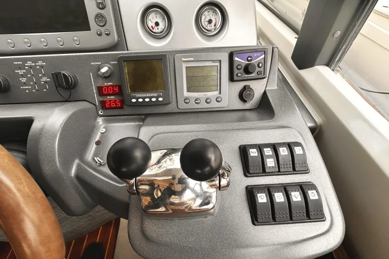 Slide: The Image of Control panel of a 2007 Azimut 43S yacht with gauges and switches. - 21