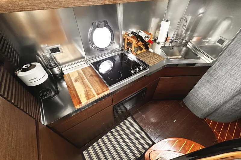 Slide: The Image of Compact kitchen in 2007 Azimut 43S yacht with modern appliances and sleek design. - 22