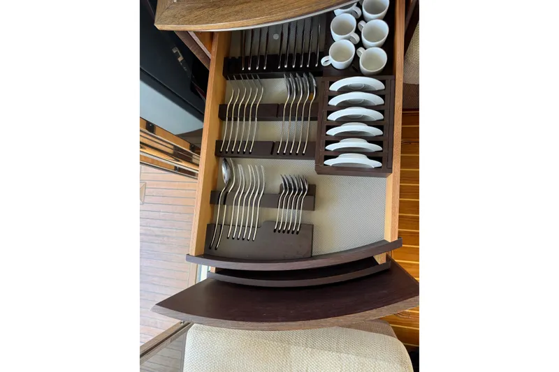 Slide: The Image of Luxury yacht Azimut 43S 2007 interior drawer with organized cutlery and cups. - 26