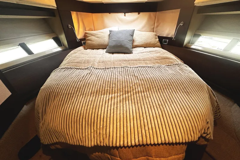 Slide: The Image of Luxurious bedroom interior of 2007 Azimut 43S yacht with cozy bedding. - 29