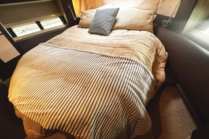 Slide: The Image of Luxurious bedroom interior of 2007 Azimut 43S yacht with cozy bedding. - 30