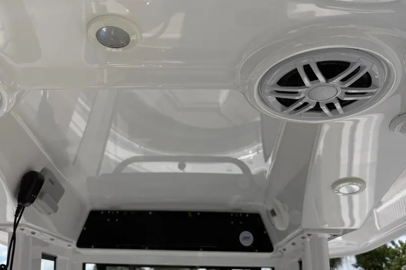 Slide: The Image of 2024 Sportsman Heritage 231 Center Console interior ceiling with speaker and lighting fixtures. - 10