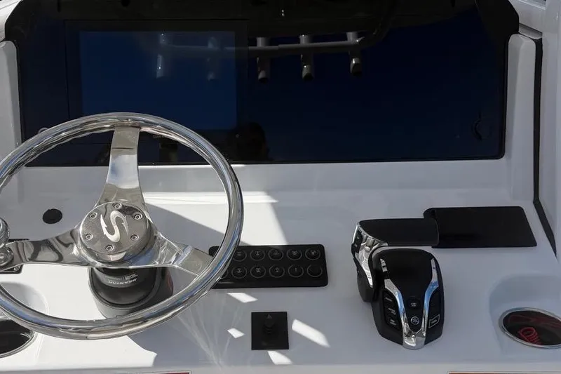 Slide: The Image of 2024 Sportsman Heritage 231 Center Console dashboard with steering wheel and controls. - 5