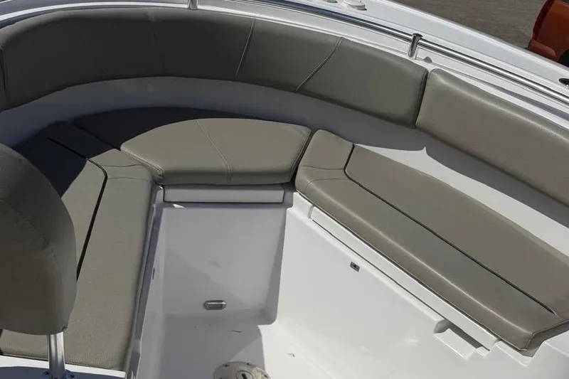 Slide: The Image of 2024 Sportsman Heritage 231 Center Console boat with cushioned seating area. - 7