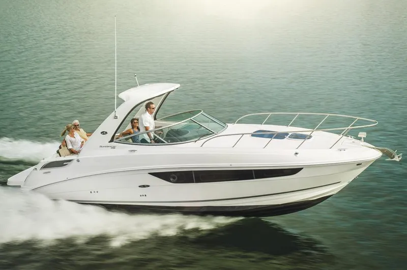 Slide: The Image of Manufacturer Provided Image: 2016 Sea Ray 310 Sundancer cruising on water with passengers. - 2