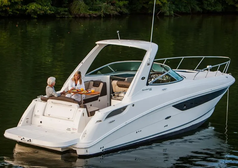 Slide: The Image of Manufacturer Provided Image: 2016 Sea Ray 310 Sundancer on a serene lake with two people dining. - 3