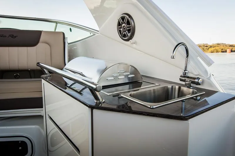 Slide: The Image of Manufacturer Provided Image: Outdoor kitchenette on 2016 Sea Ray 310 Sundancer yacht with sink and grill. - 6
