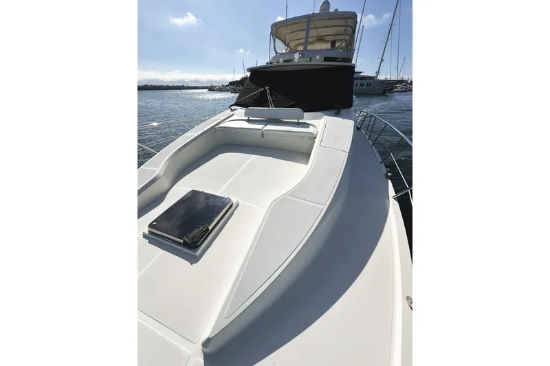 Slide: The Image of 2004 McKinna 57 PHMY Widebody yacht with stabilization, docked in a sunny marina. - 14