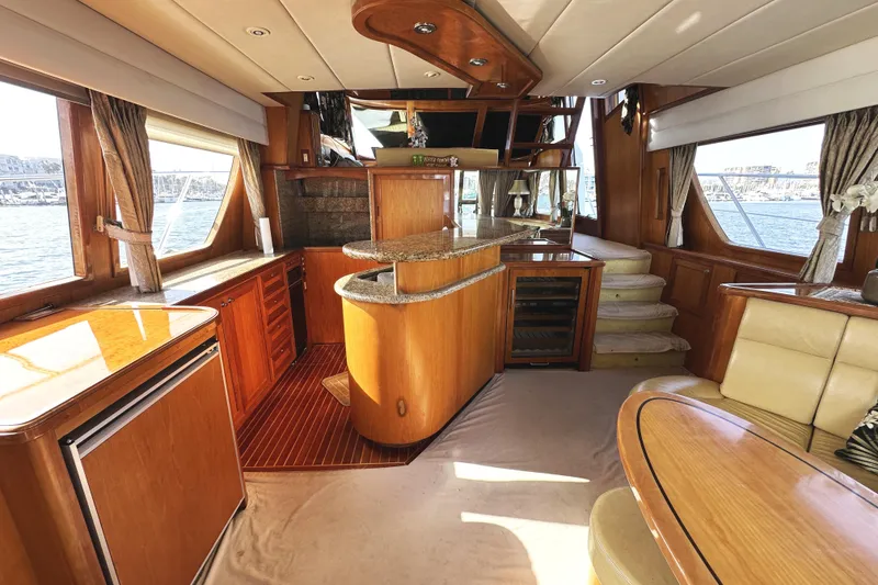 Slide: The Image of Luxurious interior of a 2004 McKinna 57 PHMY yacht with elegant wood finishes. - 29