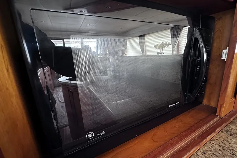 Slide: The Image of GE Profile microwave in a 2004 McKinna 57 PHMY yacht kitchen. - 41