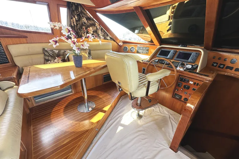 Slide: The Image of Luxurious 2004 McKinna 57 PHMY yacht interior with wood finish and floral decor. - 46