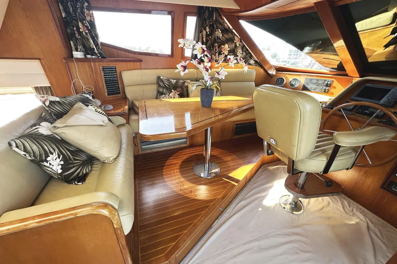 Slide: The Image of Luxurious interior of a 2004 McKinna 57 PHMY yacht with elegant seating and floral decor. - 47