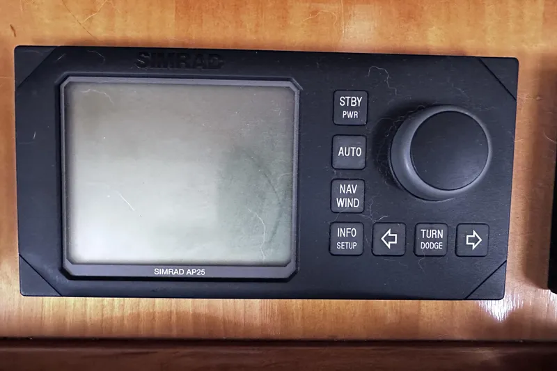 Slide: The Image of Simrad AP25 autopilot control panel on 2004 McKinna 57 PHMY yacht. - 56