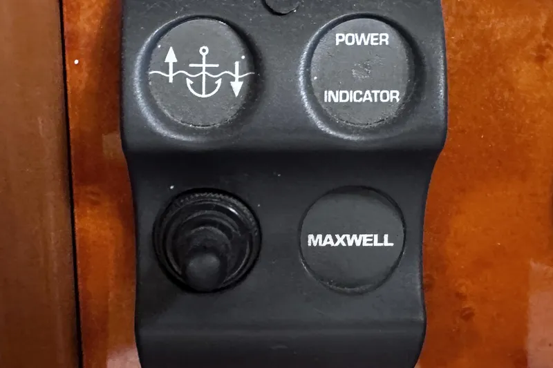 Slide: The Image of Control panel of a 2004 McKinna 57 PHMY yacht with anchor and power buttons. - 64