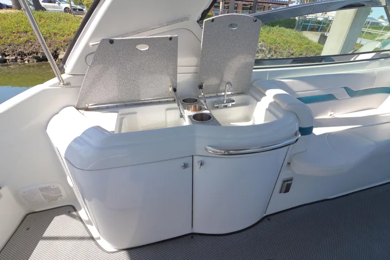 Slide: The Image of 2006 Formula 330 Sun Sport boat interior with sink and seating area. - 11