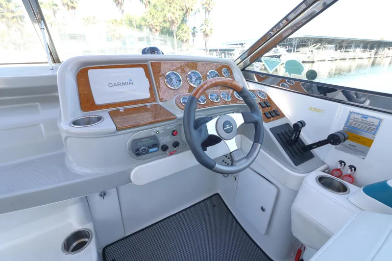 Slide: The Image of Interior cockpit of 2006 Formula 330 Sun Sport boat with Garmin navigation system. - 16