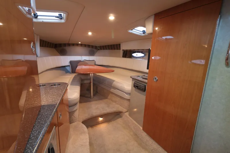Slide: The Image of Luxurious interior of a 2006 Formula 330 Sun Sport boat with plush seating and elegant wood finishes. - 18
