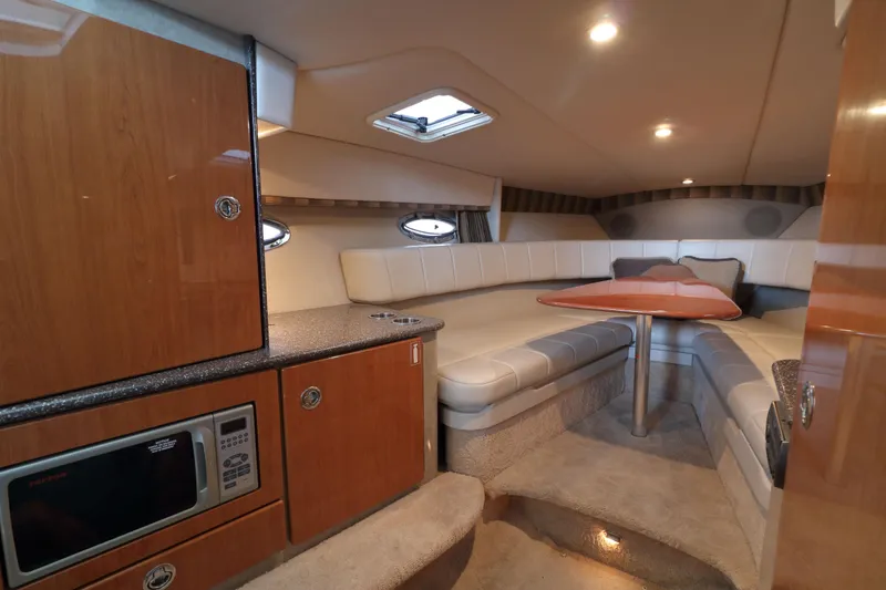 Slide: The Image of Luxurious interior of a 2006 Formula 330 Sun Sport boat with seating and kitchenette. - 19