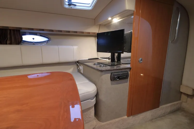 Slide: The Image of Interior of 2006 Formula 330 Sun Sport boat with TV and seating area. - 22