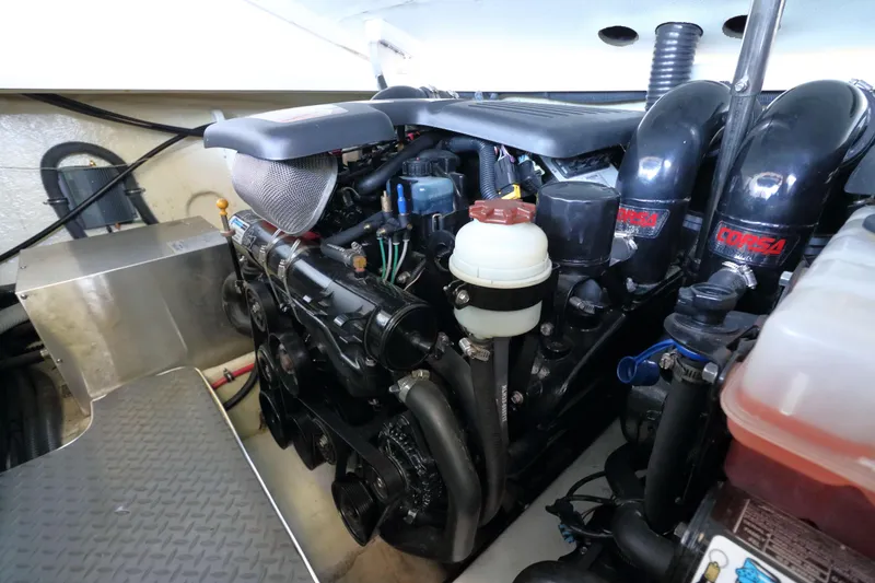 Slide: The Image of Engine compartment of a 2006 Formula 330 Sun Sport boat, featuring Corsa components. - 25