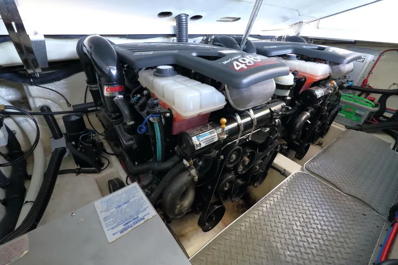 Slide: The Image of Engine room of a 2006 Formula 330 Sun Sport boat, featuring dual MerCruiser engines. - 26