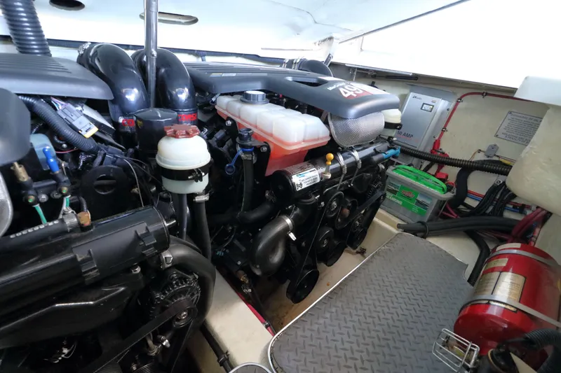Slide: The Image of Engine compartment of a 2006 Formula 330 Sun Sport boat, showcasing mechanical components. - 27