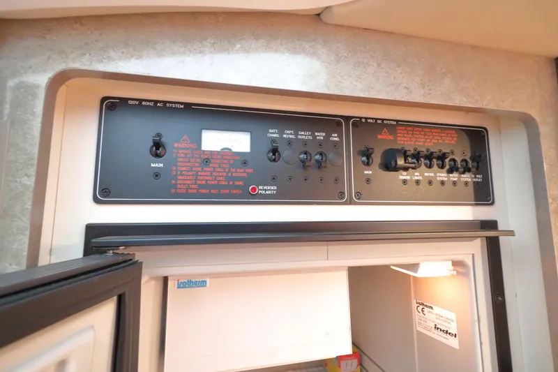 Slide: The Image of Control panel of a 2006 Formula 330 Sun Sport boat, featuring AC and DC systems. - 29