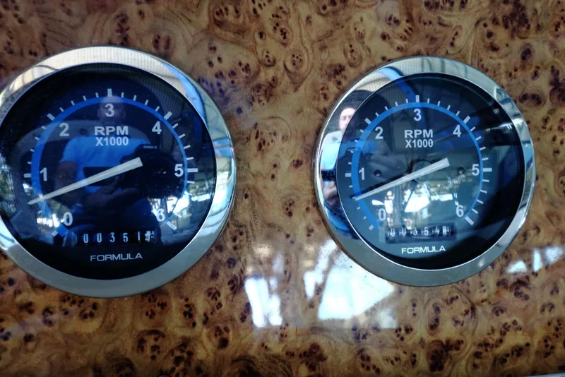 Slide: The Image of Close-up of RPM gauges on a 2006 Formula 330 Sun Sport boat dashboard. - 30