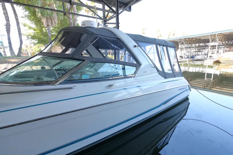 Slide: The Image of 2006 Formula 330 Sun Sport boat docked in a marina, side view. - 4