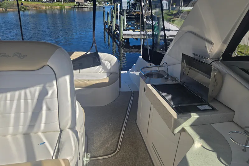 Slide: The Image of Interior view of 2010 Sea Ray Sundancer 330 yacht with seating and kitchenette. - 11