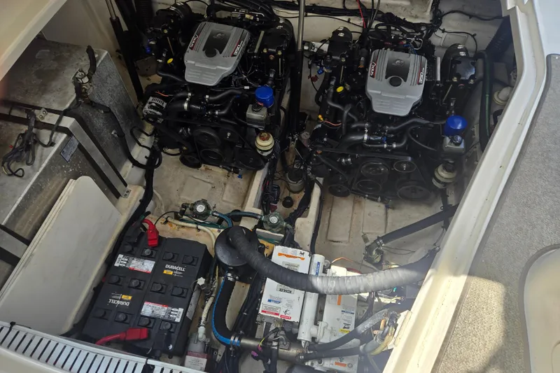 Slide: The Image of Engine compartment of a 2010 Sea Ray Sundancer 330 with dual engines and batteries. - 19