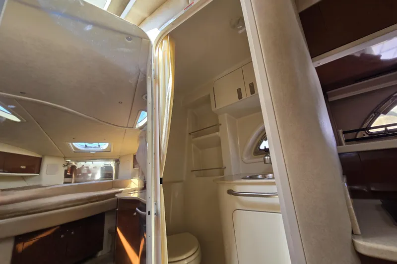 Slide: The Image of Interior of 2010 Sea Ray Sundancer 330 yacht, featuring cabin and bathroom amenities. - 20