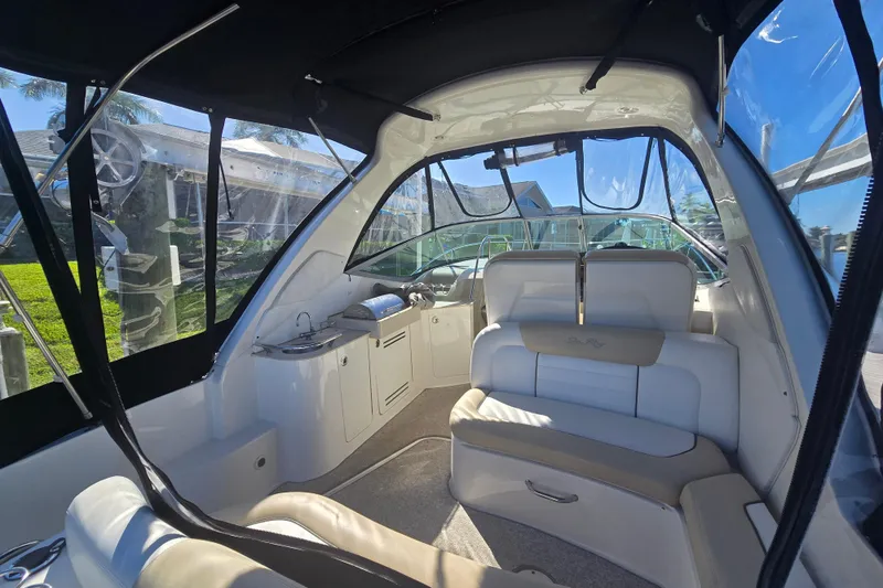 Slide: The Image of Interior of 2010 Sea Ray Sundancer 330 yacht, featuring luxurious seating and sleek design. - 9