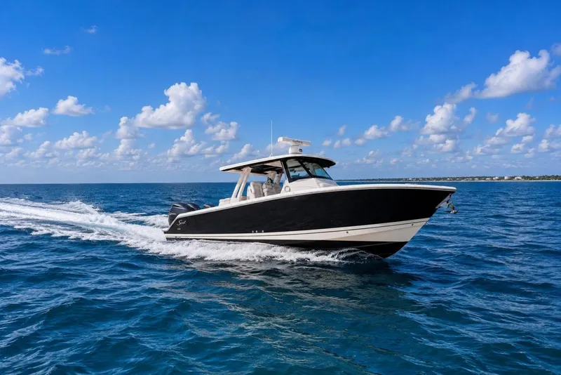 The Image of 2022 Pursuit S 358 Sport boat cruising on open blue ocean under clear sky. - 0
