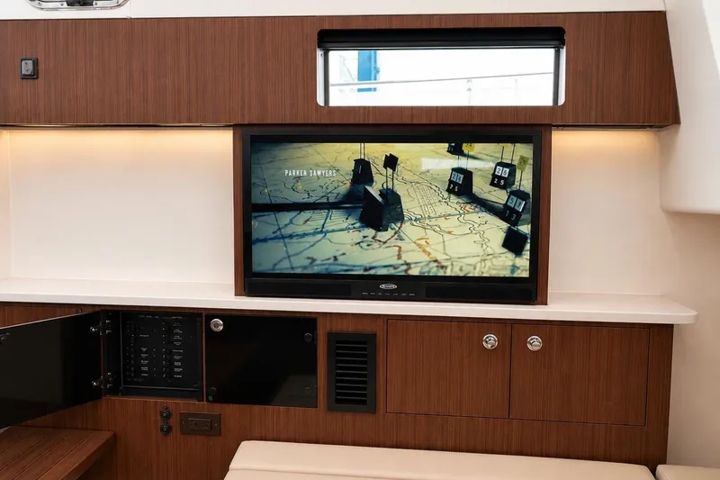 Slide: The Image of 2022 Pursuit S 358 Sport interior with TV displaying a map scene. - 10
