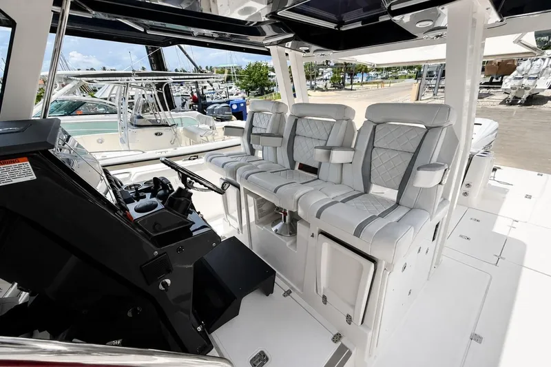 Slide: The Image of 2022 Pursuit S 358 Sport boat interior with luxurious seating and modern helm controls. - 4