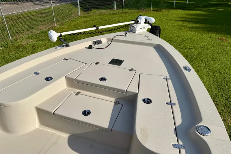 Slide: The Image of 2015 Blazer Bay 2200 Fisherman boat deck with storage compartments and trolling motor. - 5