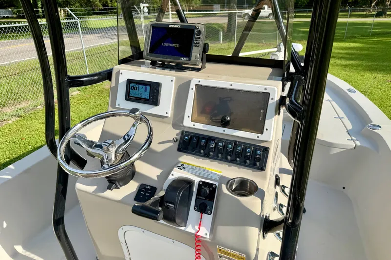 Slide: The Image of 2015 Blazer Bay 2200 Fisherman boat console with steering wheel and navigation equipment. - 6